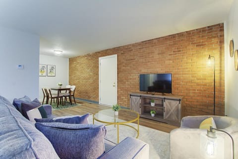 Open living area with comfortable seating and Smart TV