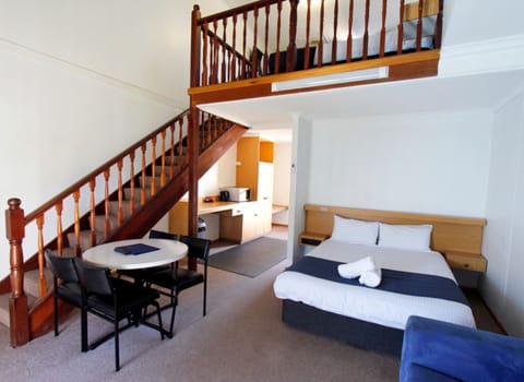 Family Loft, Pool View | Living area | 32-inch TV with digital channels, streaming services