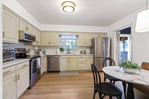 This fully equipped kitchen is designed to meet all your cooking and entertaining needs. Outfitted with stainless steel appliances, a full-size oven, microwave, dishwasher, and a refrigerator/freezer combo to keep everything fresh and organized.
