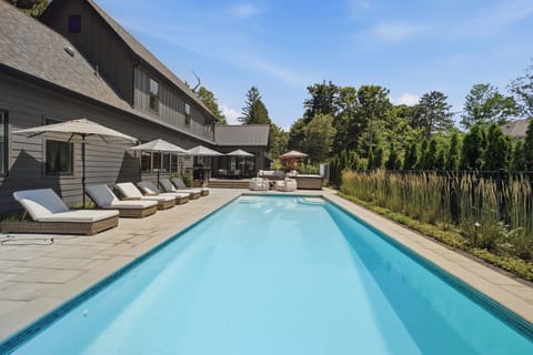 Heated saltwater pool with resort-style lounge seating creates the perfect place to spend long summer afternoons. Relax poolside, take a refreshing swim, or unwind in the sunshine just steps from McKinley Beach.