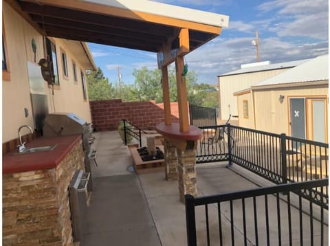 Patio with grill, fire pit & seating and water feature