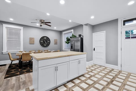 Stylish space with a large table and modern decor—perfect for lively gatherings!