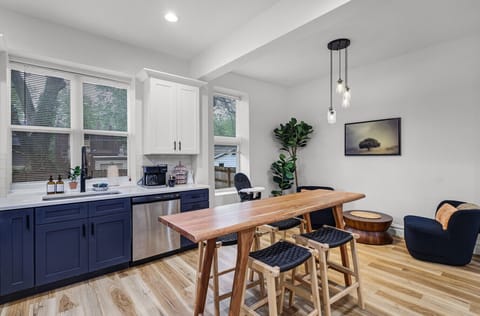 Two cozy single chairs with a coffee table for quiet moments or casual chats. Bright and inviting space perfect for meals, laughter, and unforgettable moments!