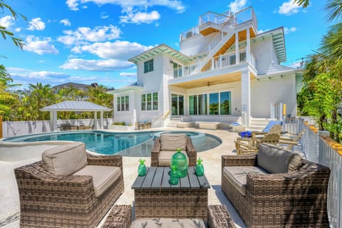 The back patio WOW - lounge area with the pool, dining gazebo, fire pit and roof patio with spectacular views!