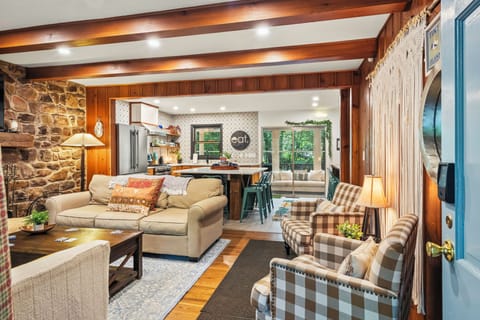 Open-concept living space with warm wood details and classic furnishings.