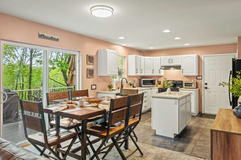 Open-concept layout connecting the living room to the kitchen and dining space.