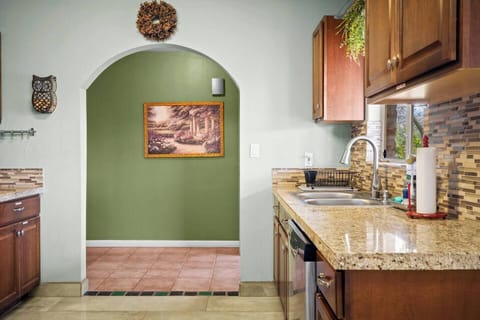 Kitchen | Fully stocked with pots, pans, silverware, bowls, plates, paper towels, stainless steel appliances, knives, dishwasher, and more.