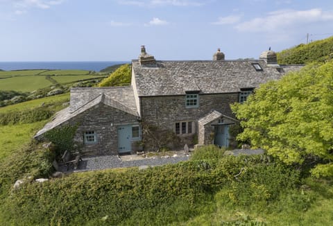 Warmly welcoming you to Besloe, a Grade II Listed cottage, just moments from the sandy shores of Trebarwith Strand
