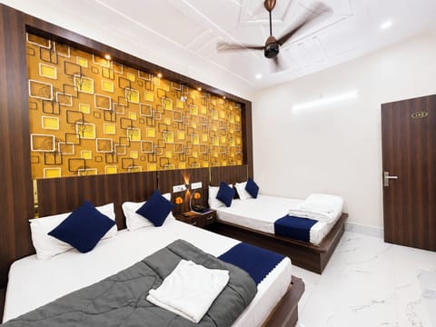 Deluxe Quadruple Room, City View | In-room safe, soundproofing, free WiFi, bed sheets