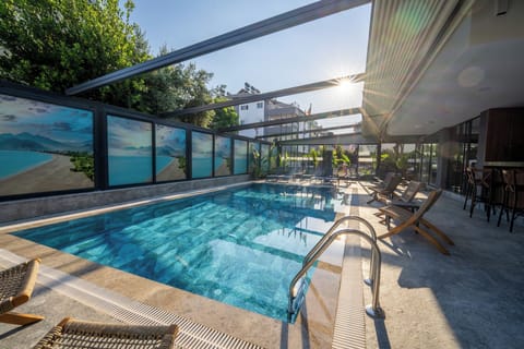 Indoor pool, outdoor pool, open 9:00 AM to 7:00 PM, pool umbrellas