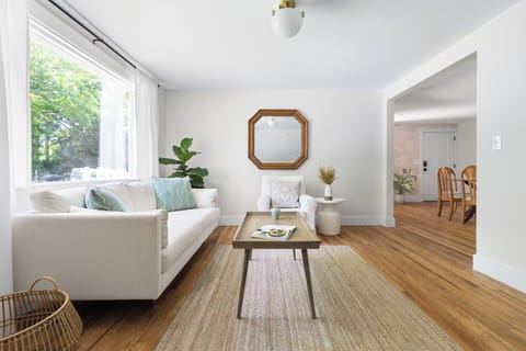 Wall-mounted Smart TV is present in the living room, not captured in this image.