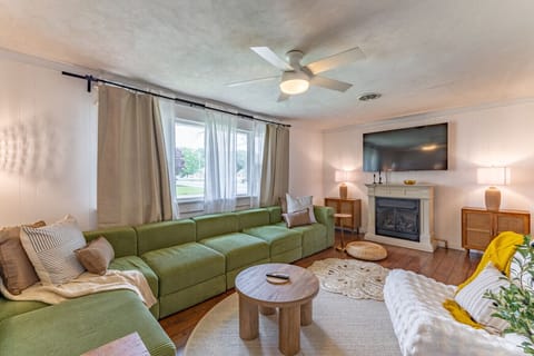 Comfort Meets Charm – Spacious Living Room with Natural Light and Modern Touches
