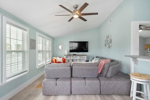 Living room right as you enter. Inviting ambiance enhanced by beautiful natural light