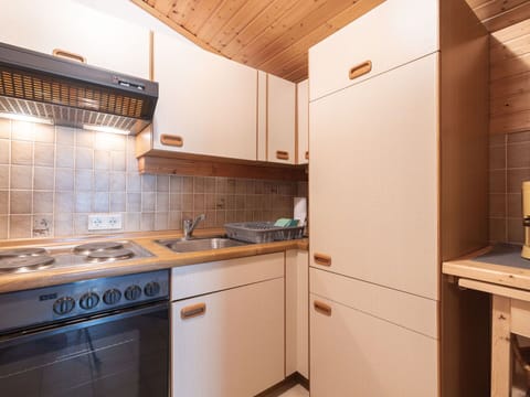 Wood, Interior Design, Kitchen, Cabinetry, Flooring, Floor, Ceiling, Countertop, Room, Major Appliance