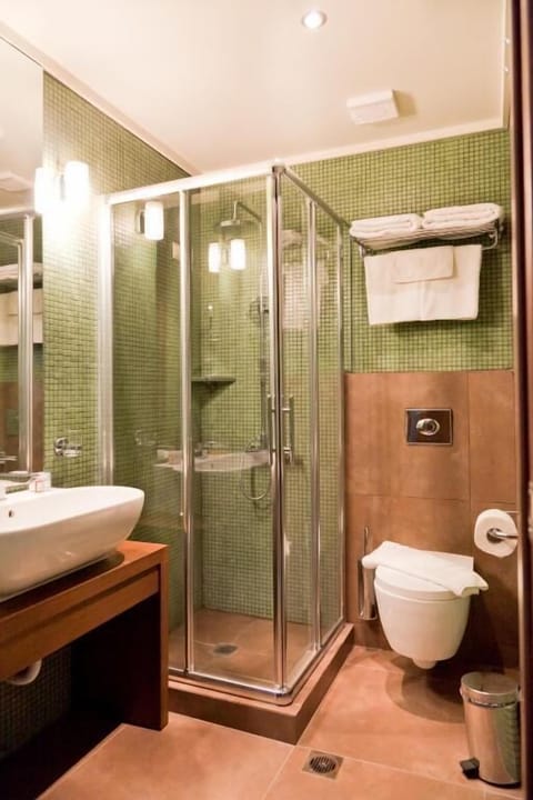 Economy Double Room, Balcony, City View | Bathroom | Shower, hair dryer, slippers, towels