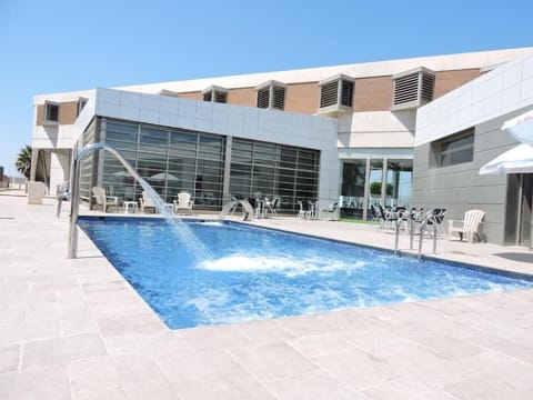 Seasonal outdoor pool, open 11:00 AM to 7:00 PM, pool umbrellas