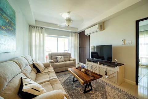Living Room with lovely 3 seater and love seat with 55" Smart TV