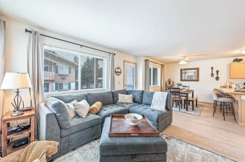 Open concept living room with Smart TV and fireplace