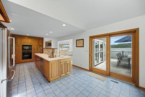 Kitchen with patio doors to the second floor deck and outdoor dining space
