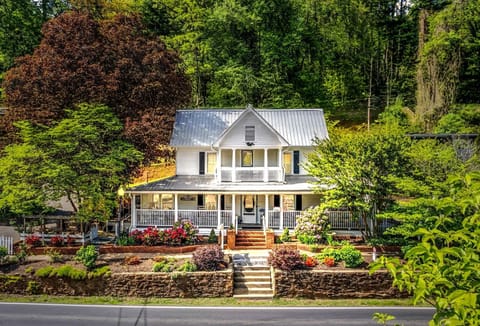 The Whistle Stop Inn, a charming historical home located in the heart of Dillsboro.  This beautiful home has operated as an original bed & breakfast dating back to 1905.  You can feel the history of this property from the first step inside.  