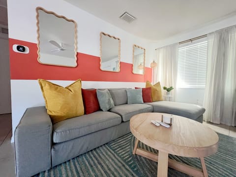 Deep Seat Cozy Couch. Two Ottomans Provided for Additional Seating. 