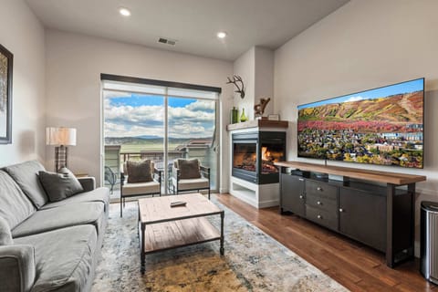 What a nice living area with big screen TV and fireplace 