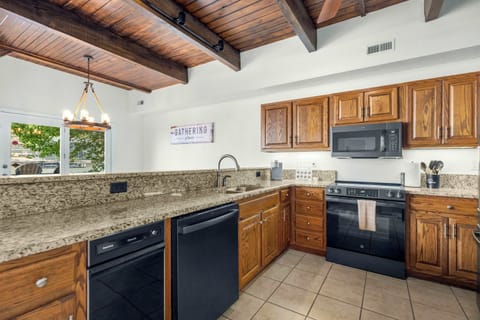 Fully equipped kitchen with everything you need for meals and counter seating for 4