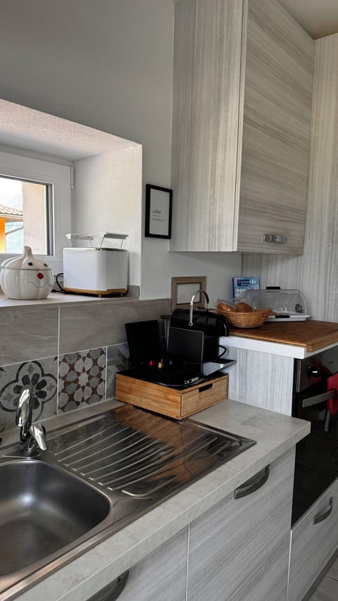 Comfort Room, Courtyard View | Private kitchen | Espresso maker, coffee/tea maker, electric kettle, toaster