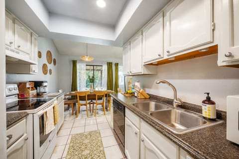 Fully functional kitchen. Stove, oven, fridge, coffee machine, and blender.