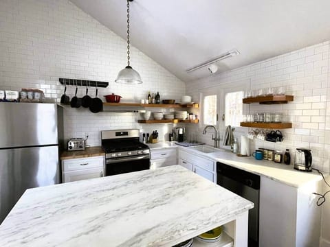 Our fully furnished kitchen is stocked with all the essentials—plates, pans, pots, utensils, and more. Whether you're crafting gourmet meals or whipping up decadent desserts, this space is designed for creativity, convenience, and culinary delight.