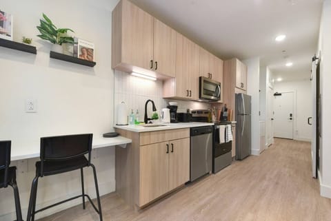 The kitchen invites you to experiment with new recipes, offering a stylish and practical space to cook and create.