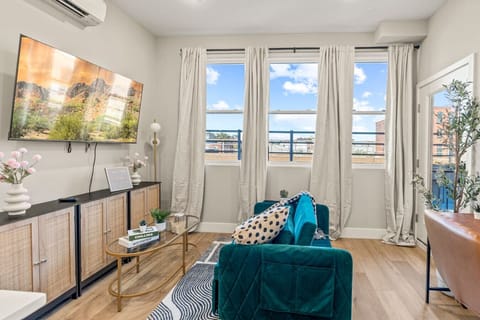 You feel a sense of peace as you step into the living room , with its inviting decor and soothing tones.