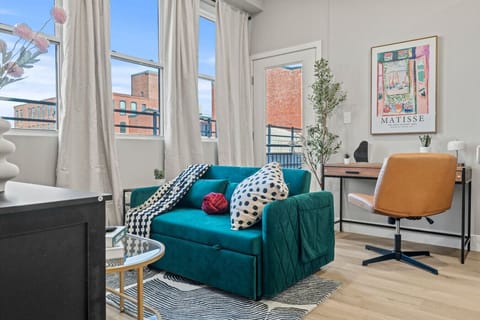 You feel a sense of peace as you step into the living room , with its inviting decor and soothing tones.