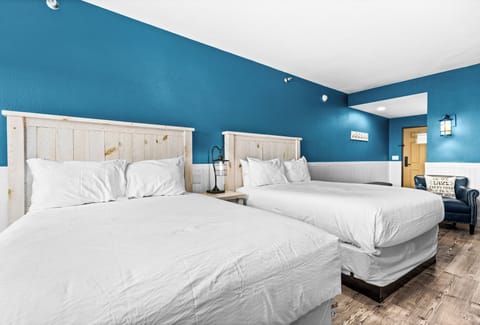 Two plush queen beds for a restful lakeside stay
