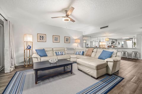 Following a day by the waves and sun, relax in Surfside’s comfy hub—a place made for movie marathons, shared memories, and effortless comfort.