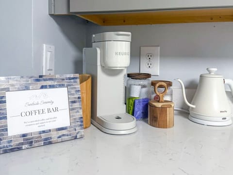 Wake up to convenience and comfort at your personal coffee bar, featuring a Keurig and handpicked coffee selections.