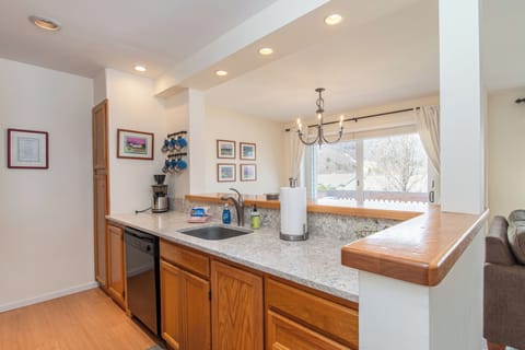 - Open kitchen with breakfast bar and bright lighting - Easy access to dining area with mountain view windows - Cook, serve, and gather in one inviting space
