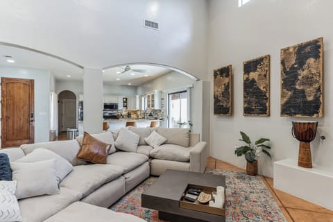 Living room view toward the open-concept kitchen