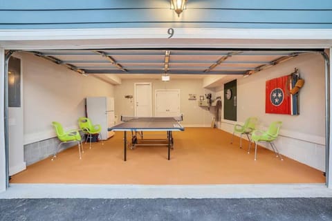 Garage has a ping pong table but will still accommodate one car. Additional parking nearby.