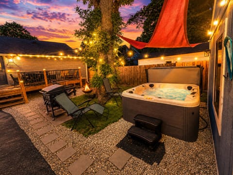 Ease into the hot tub the moment the sun drops - your private corner of Indy, string lights glowing, the whole yard to yourself.