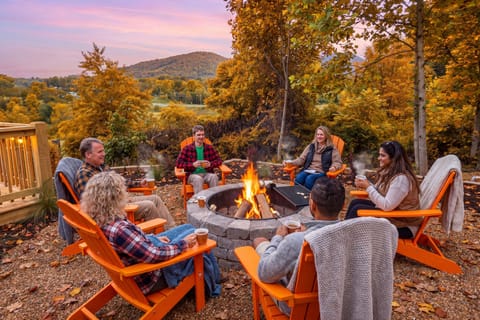 Cozy fire pit lounge with mountain views and stunning autumn colors