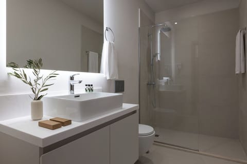 Shower, hair dryer, slippers, towels