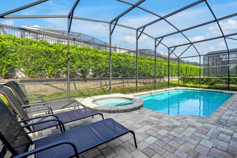 Enjoy your own screened-in pool and spa, perfect for relaxing after a day at Disney. Plenty of space for sunbathing, family fun, and evening swims.