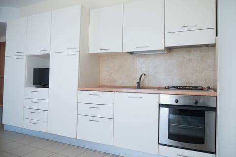 Apartment, Partial Sea View | Private kitchen | Fridge, oven, stovetop, cookware/dishes/utensils