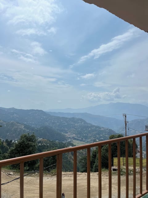 Deluxe Double Room, Balcony, Hill View | Living area | 32-inch Smart TV with cable channels