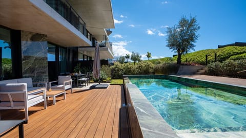 Cloud9 by LovelyStay – unwind in style on a private deck with pool, outdoor dining, and lounge. Gym, shared pool, and private parking included. #monumentalis #luxury #privatepool #patio