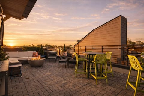 Rooftop terrace with TV, fire pit, gas grill, and mini fridge