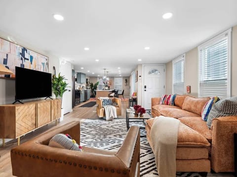 Open living space flowing from lounge to kitchen, perfect for gathering together