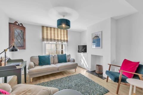 Spacious lounge with cozy seating, natural light, and modern decor