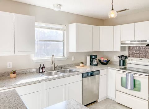 Nice clean kitchen with white cabinets